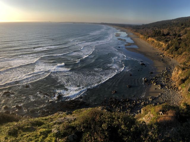 Ocean beach view next to the mountains